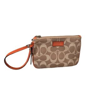 Coach signature C  Wristlet Tan with Pink trim and hangtag